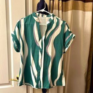 Woman’s blouse.  Size Large. Excellent condition.  100% polyester